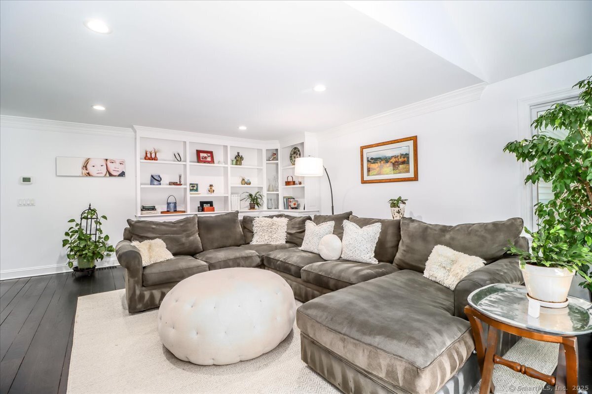 81 Graenest Ridge Road Wilton, CT 06897 - Photo 13 of 39 a living room with furniture and flowers