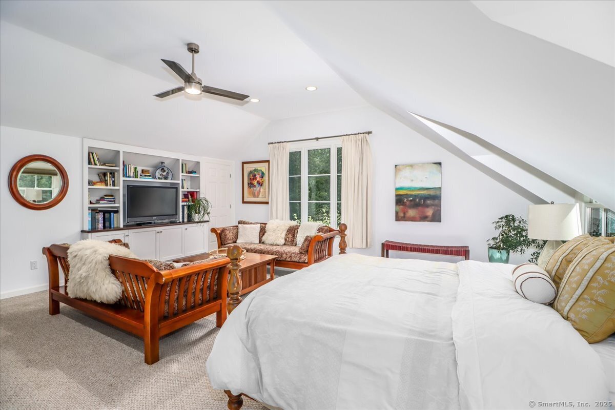81 Graenest Ridge Road Wilton, CT 06897 - Photo 20 of 39 a living room with furniture and a large window