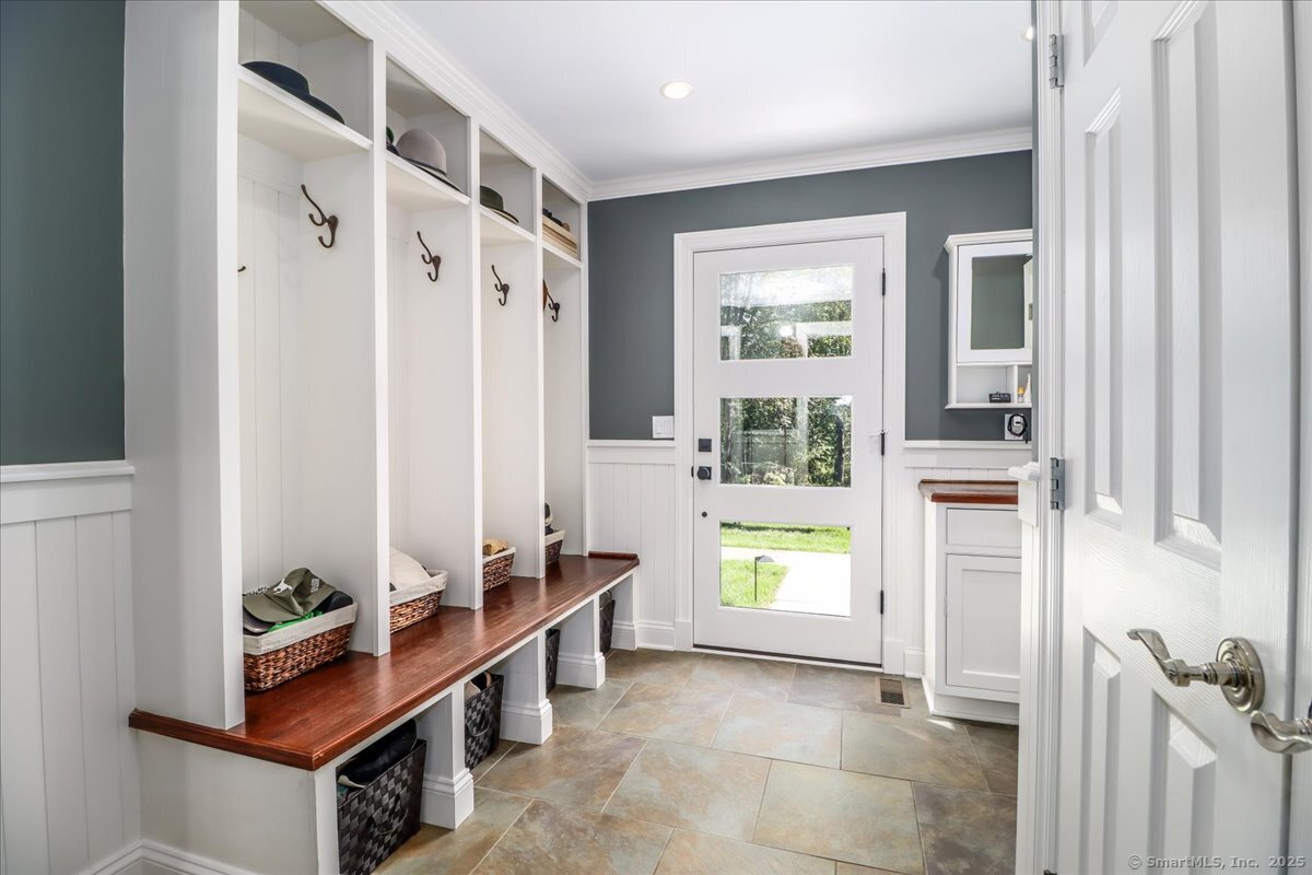 81 Graenest Ridge Road Wilton, CT 06897 - Photo 30 of 39 a view of an entryway with wooden floor and a window