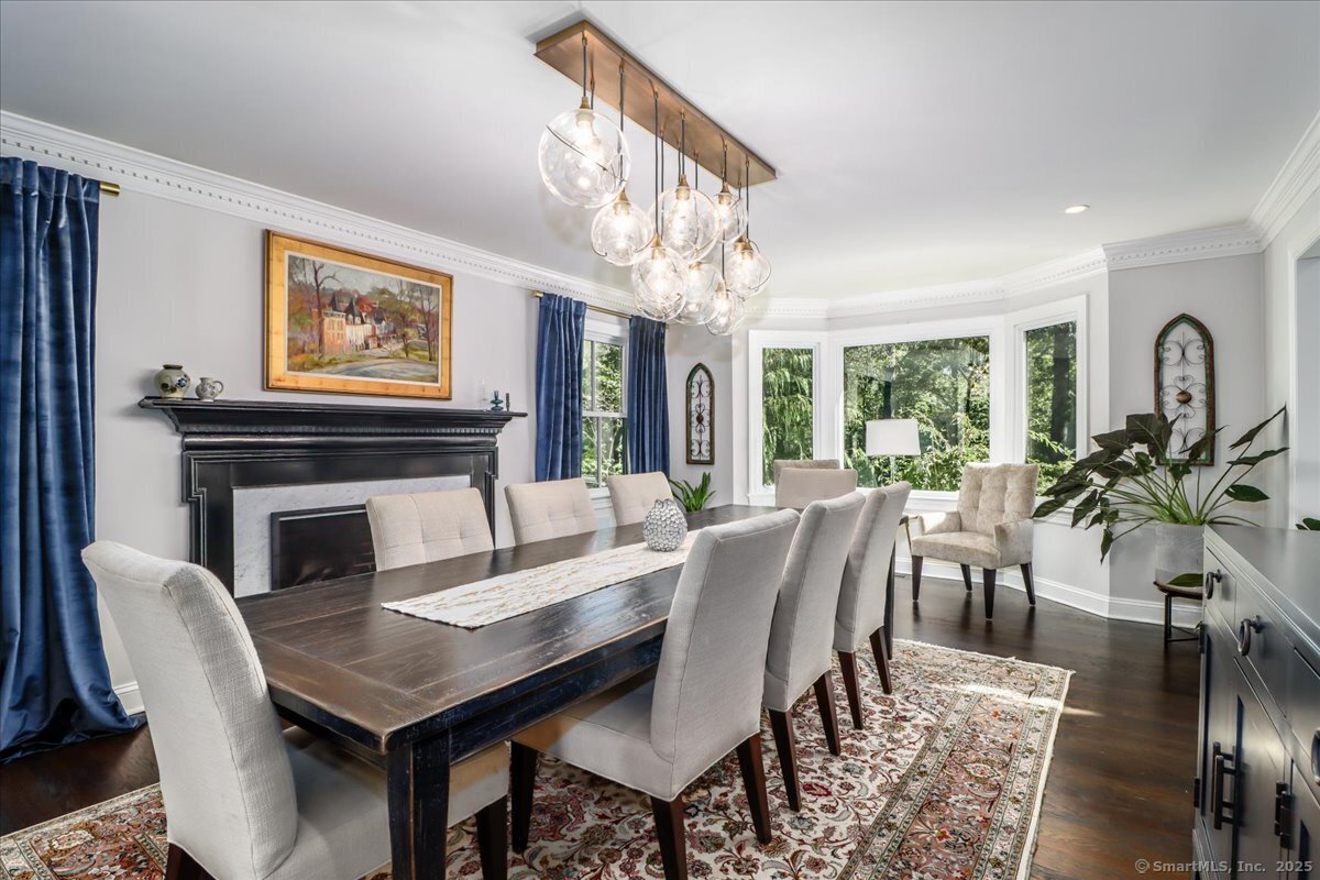 81 Graenest Ridge Road Wilton, CT 06897 - Photo 3 of 39 a view of a dining room with furniture window and wooden floor