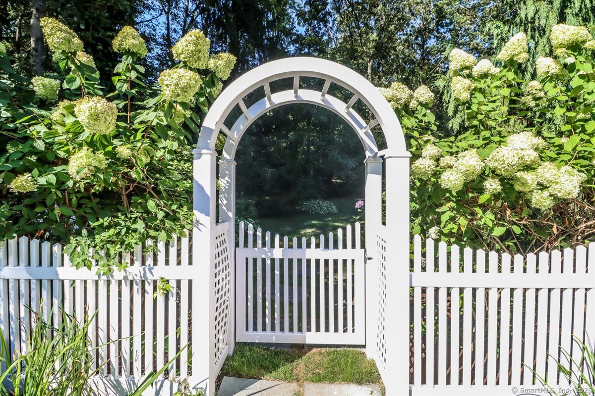 81 Graenest Ridge Road Wilton, CT 06897 - Photo 31 of 39 a view of a house with a small yard
