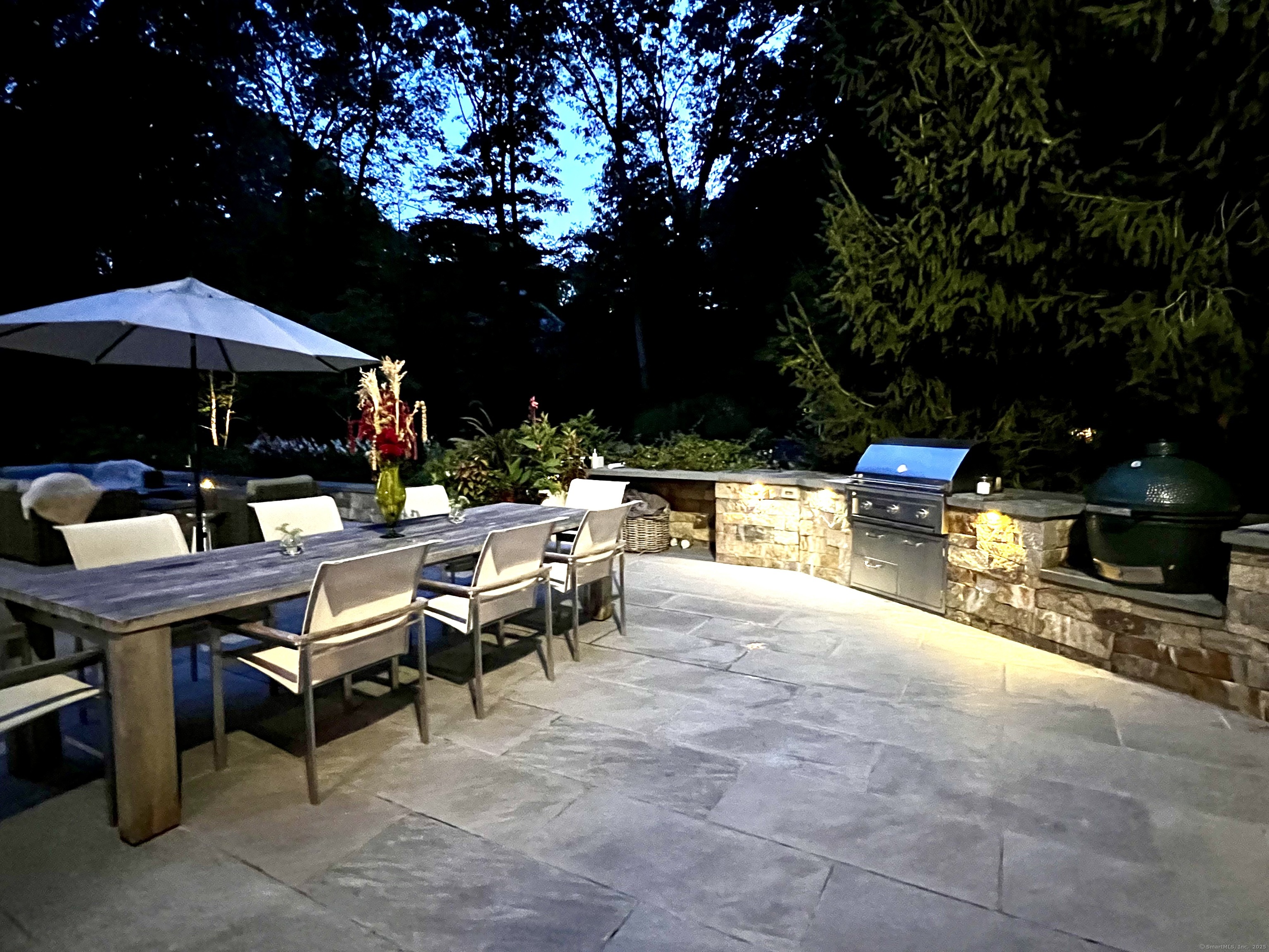 81 Graenest Ridge Road Wilton, CT 06897 - Photo 34 of 39 a view of a patio with chairs and tables