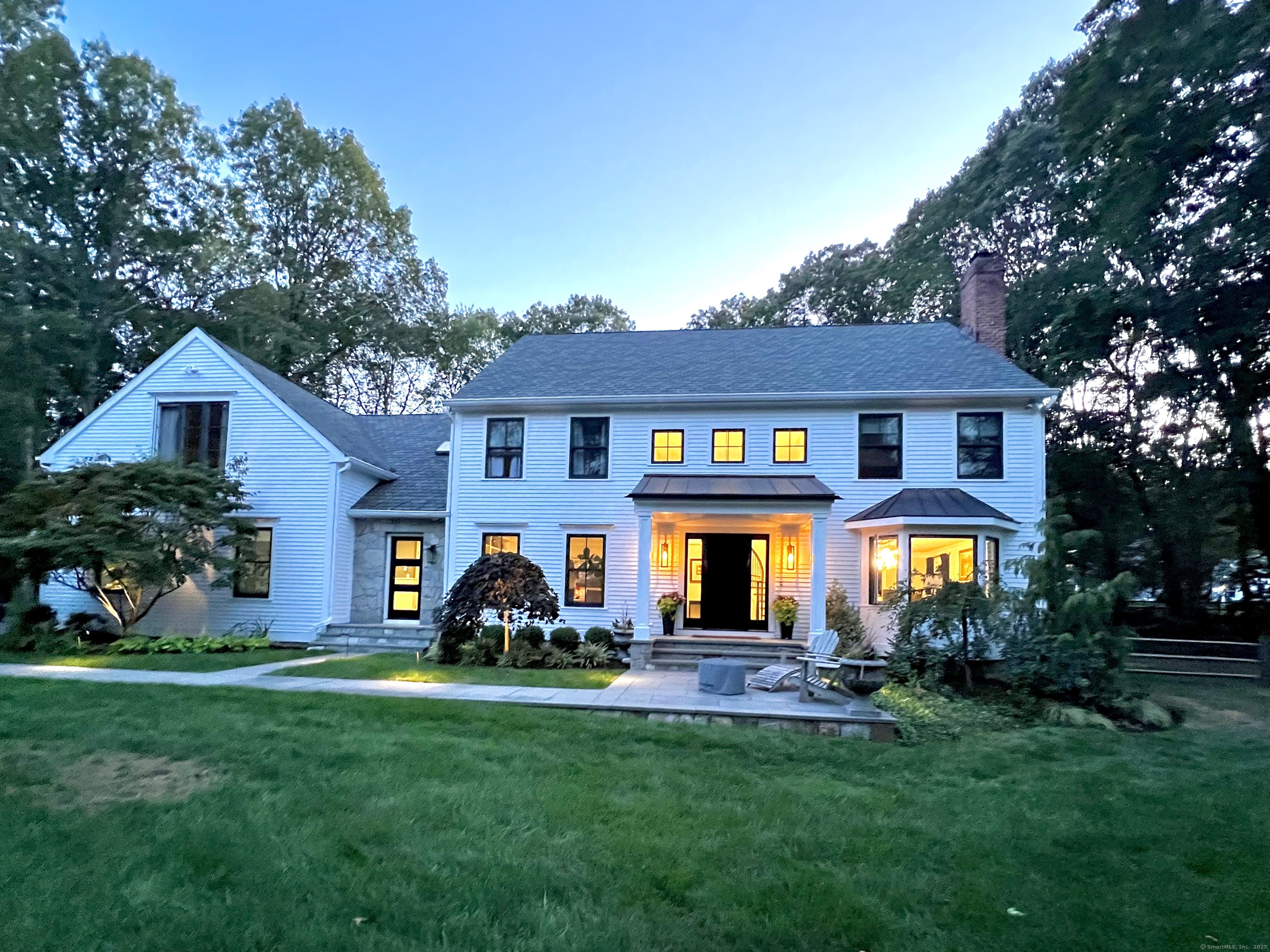 81 Graenest Ridge Road Wilton, CT 06897 - Photo 36 of 39 a front view of a house with garden