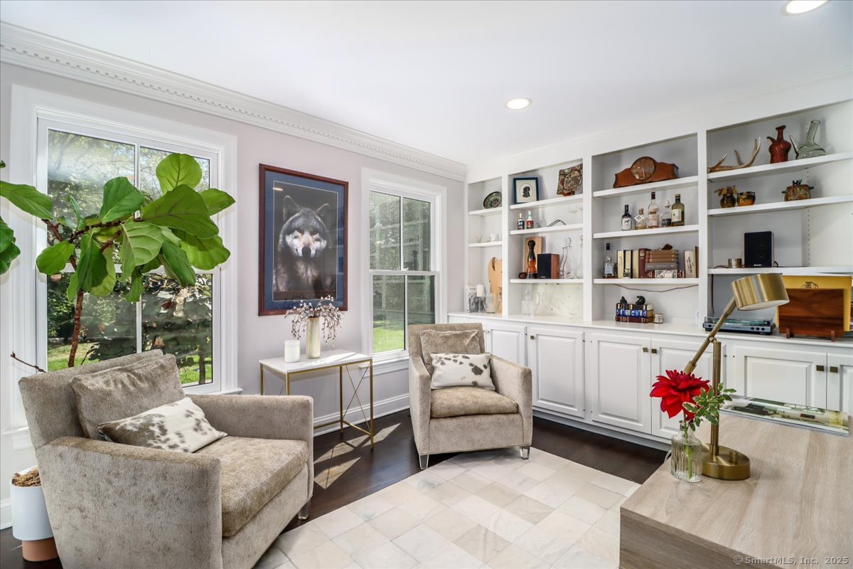 81 Graenest Ridge Road Wilton, CT 06897 - Photo 5 of 39 a living room with furniture and a potted plant on the table