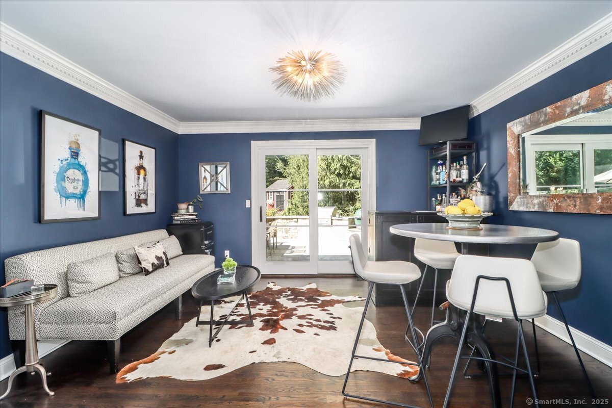 81 Graenest Ridge Road Wilton, CT 06897 - Photo 6 of 39 a living room with furniture and a large window