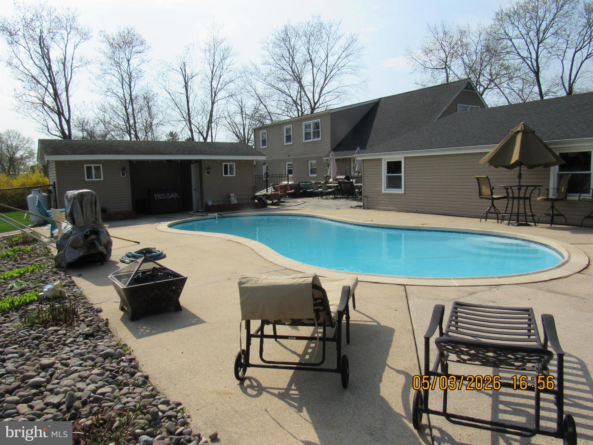 1276 Stump Hall Road Collegeville, PA 19426 - Photo 41 of 46 a view of a patio with table and chairs with wooden floor and a barbeque