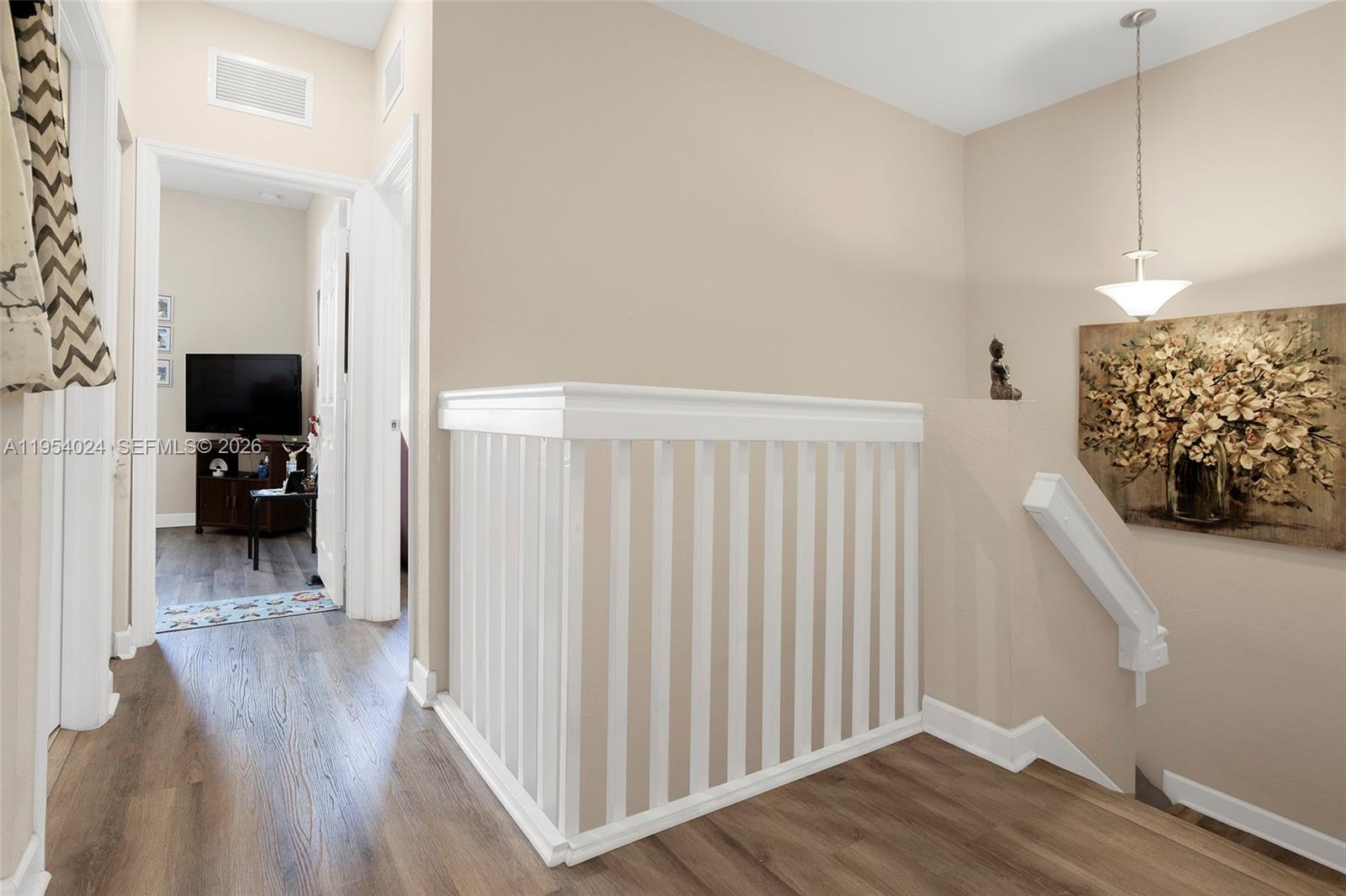 17149 Southwest 94th Street Miami, FL 33196 - Photo 17 of 36 a view of a livingroom with wooden floor and furniture