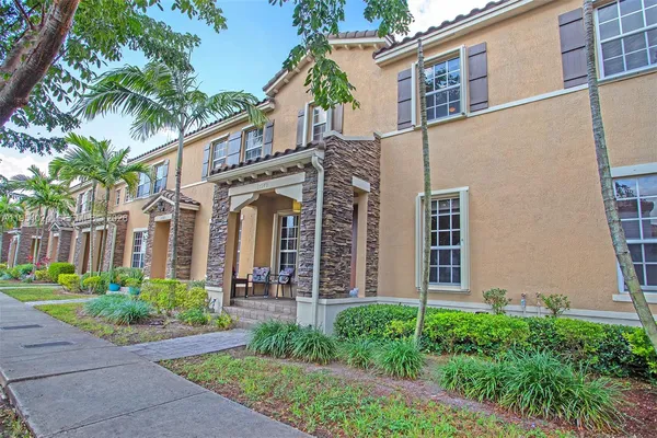 front view of a house with a garden