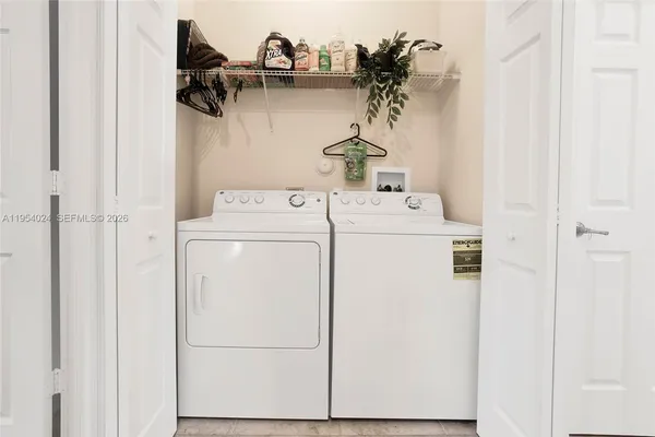 a utility room with dryer and washer