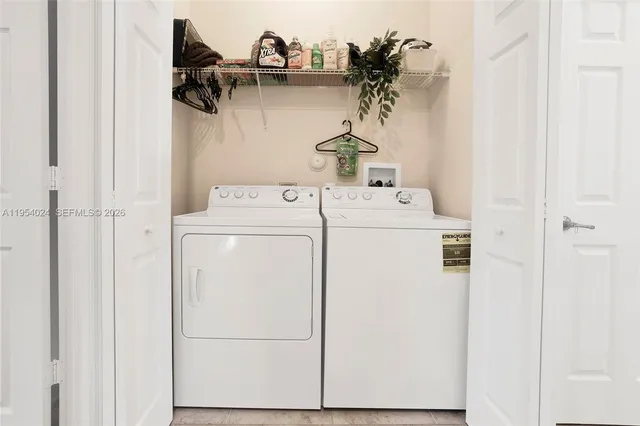 a utility room with dryer and washer
