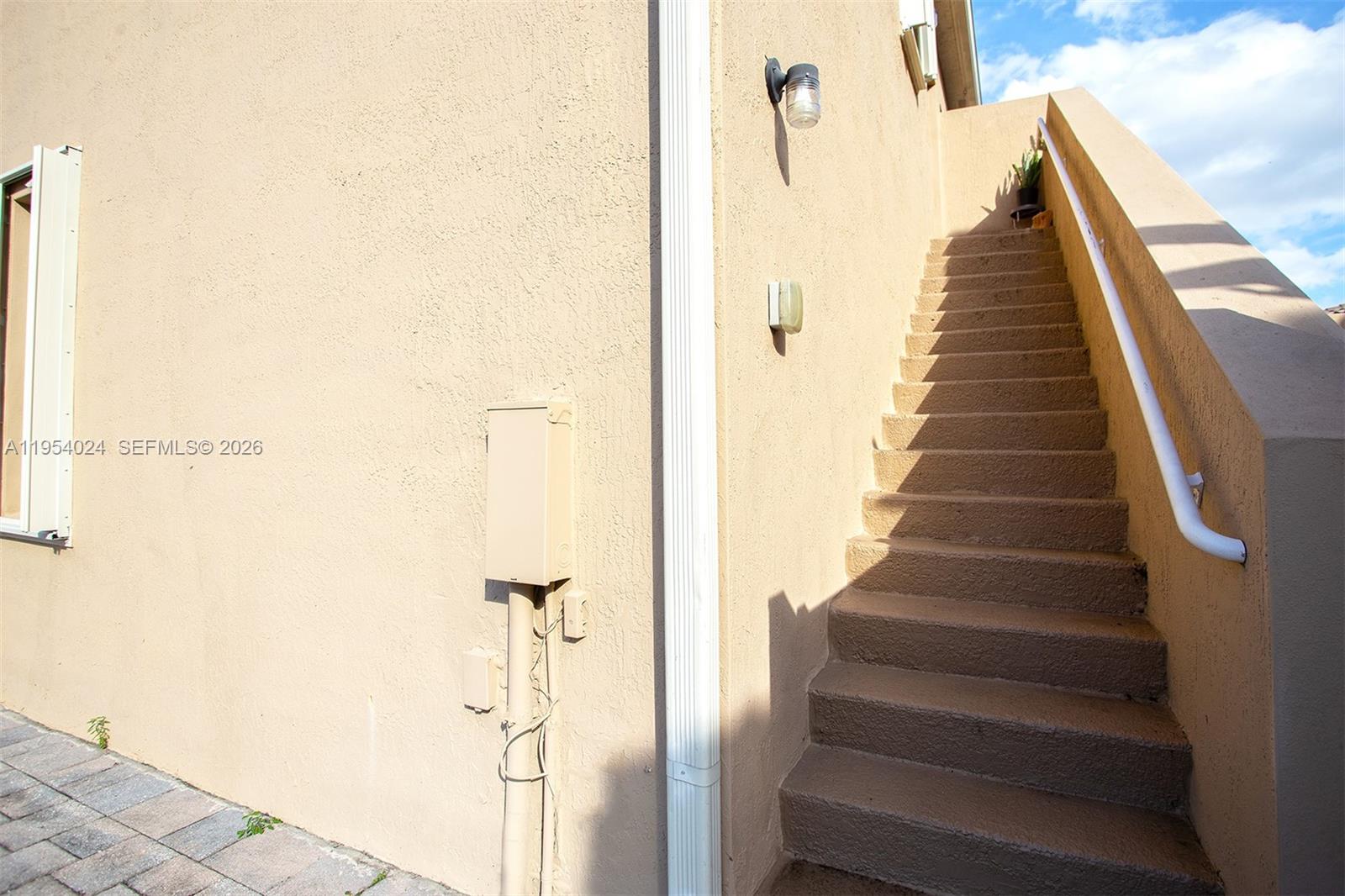 17149 Southwest 94th Street Miami, FL 33196 - Photo 34 of 36 a view of a hallway with wooden floor and entryway