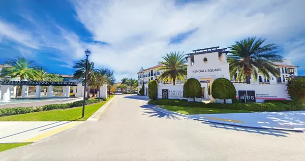 a front view of building with yard