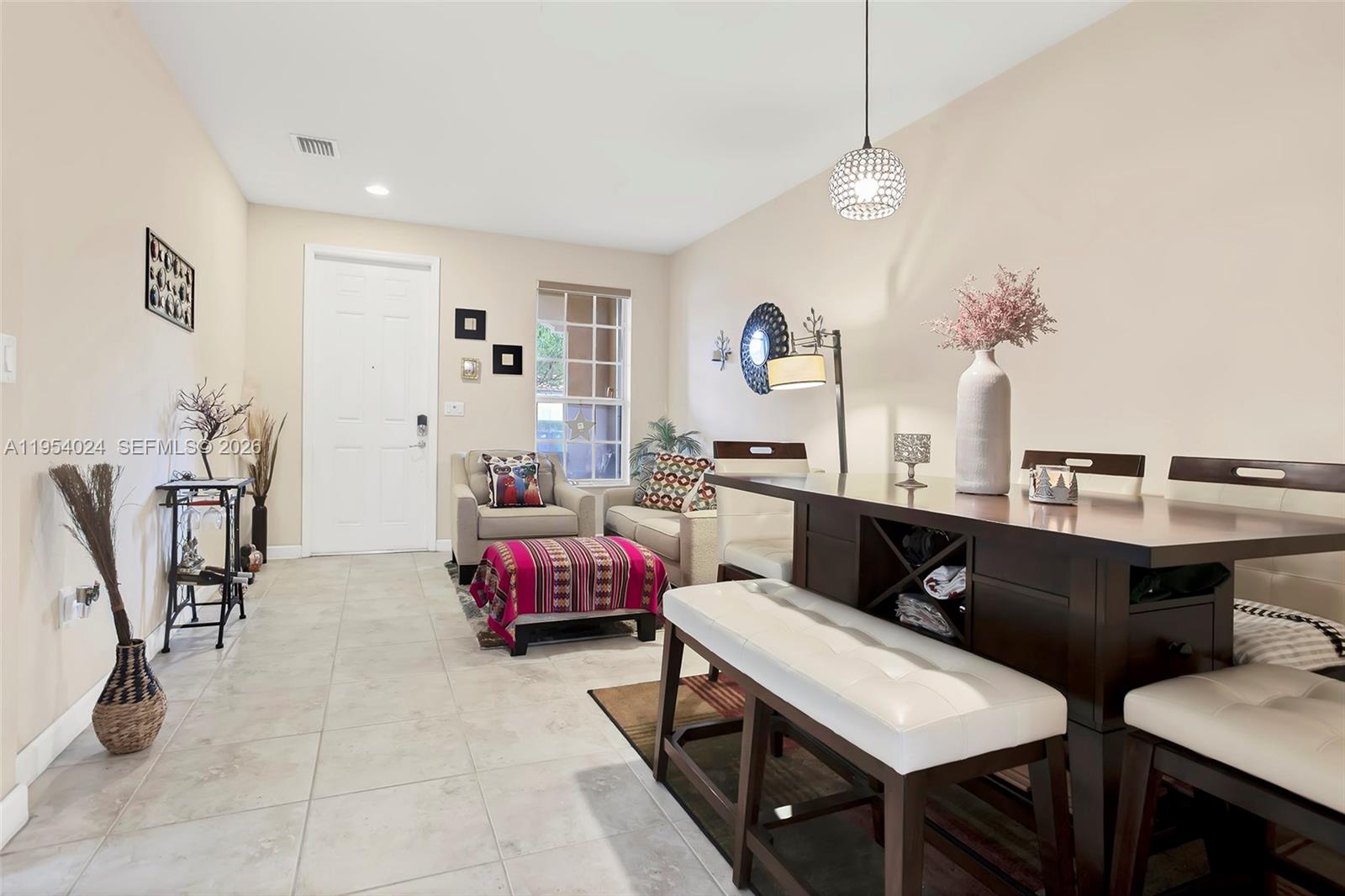 17149 Southwest 94th Street Miami, FL 33196 - Photo 8 of 36 a living room with furniture and wooden floor