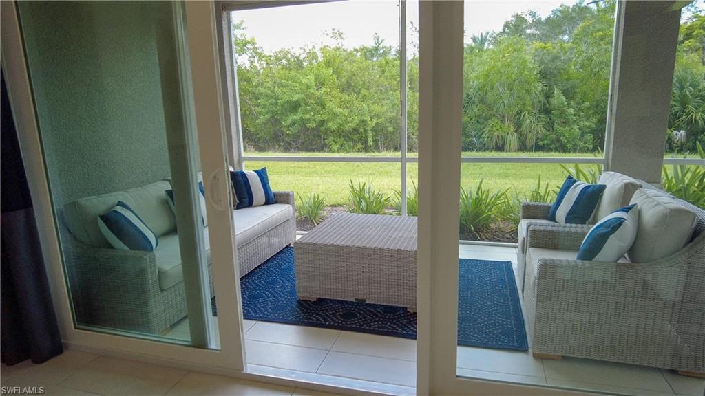 172 Indies Drive East, Unit 8102 Naples, FL 34114 - Photo 29 of 49 a view of balcony with couch and city view