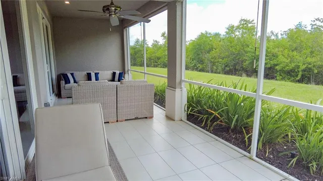 a view of roof deck with furniture and garden
