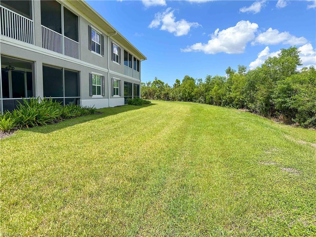 172 Indies Drive East, Unit 8102 Naples, FL 34114 - Photo 36 of 49 a view of outdoor space yard and balcony