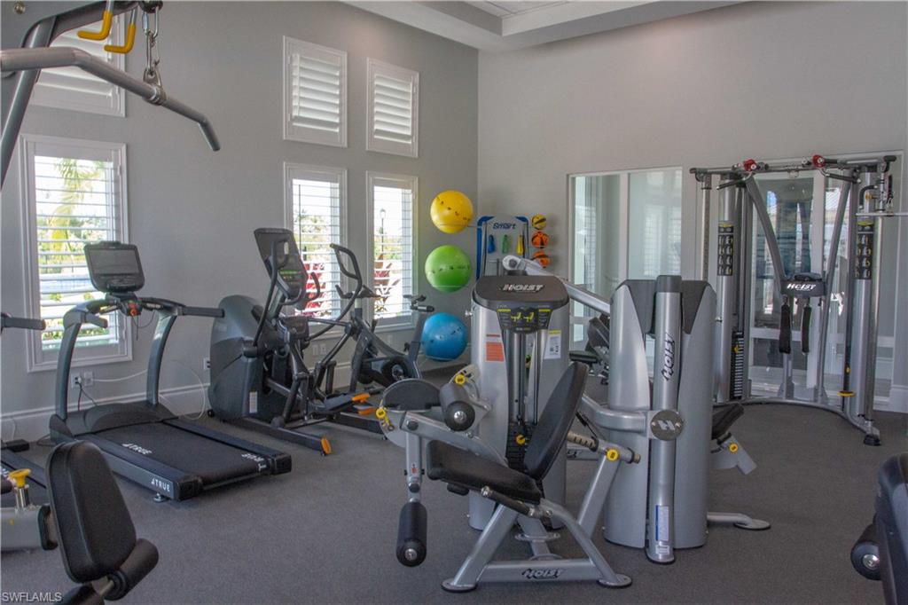 172 Indies Drive East, Unit 8102 Naples, FL 34114 - Photo 41 of 49 a view of a room with gym equipment