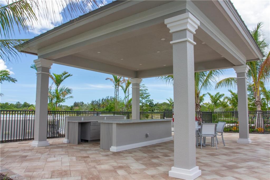 172 Indies Drive East, Unit 8102 Naples, FL 34114 - Photo 46 of 49 a view of a outdoor space with a porch
