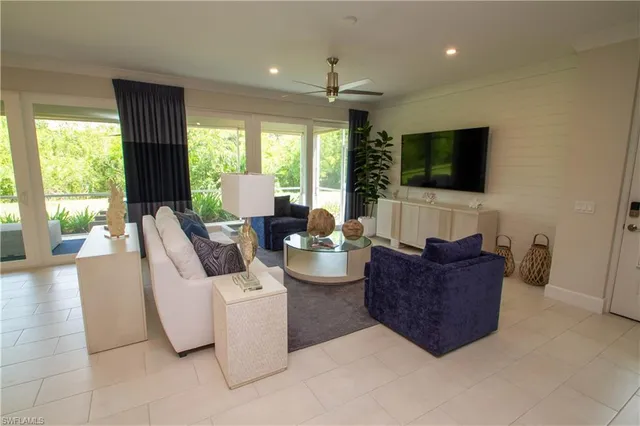 a living room with fireplace furniture and a flat screen tv