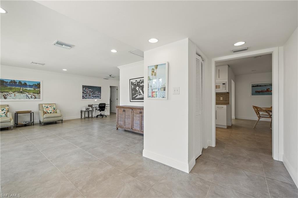 540 Rudder Road Naples, FL 34102 - Photo 16 of 37 Hallway with recessed lighting, crown molding, baseboards, and visible vents