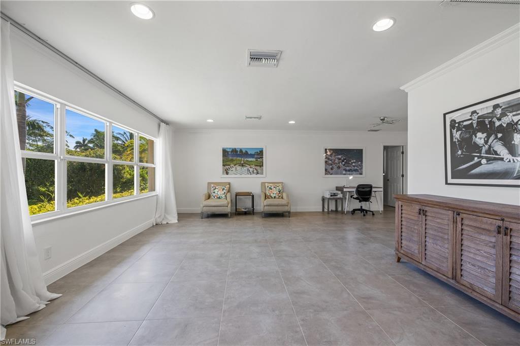 540 Rudder Road Naples, FL 34102 - Photo 9 of 37 Living area featuring baseboards, visible vents, recessed lighting, and crown molding