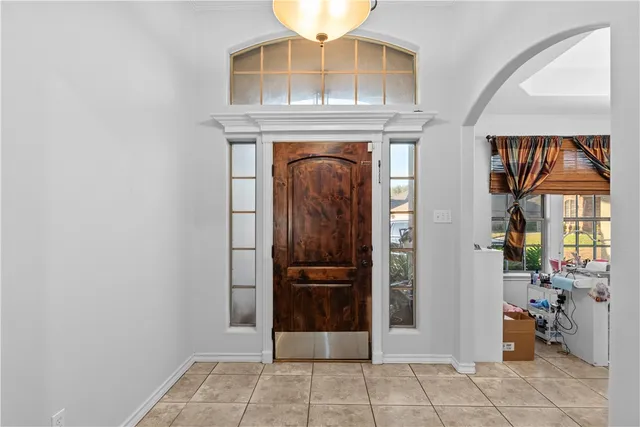 a view of a entryway door with hallway