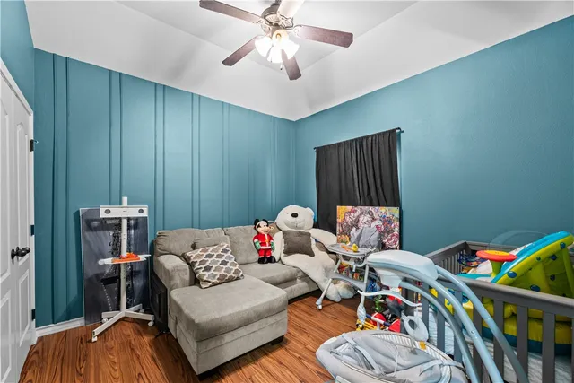 a bedroom with furniture and a chandelier