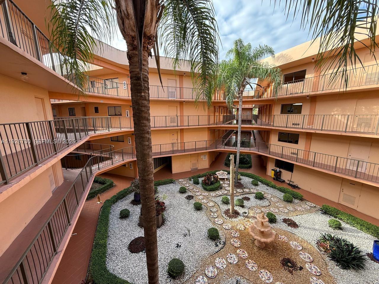 8600 Southwest 133rd Avenue Road, Unit 310 Miami, FL 33183 - Photo 12 of 22 a outdoor space with a barbeque oven and glass door