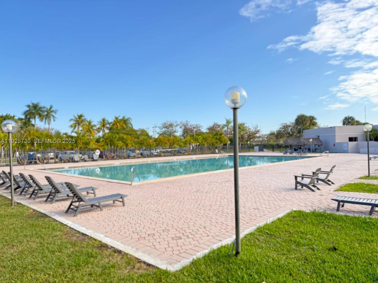 8600 Southwest 133rd Avenue Road, Unit 310 Miami, FL 33183 - Photo 20 of 22 a view of a house with a yard and sitting area