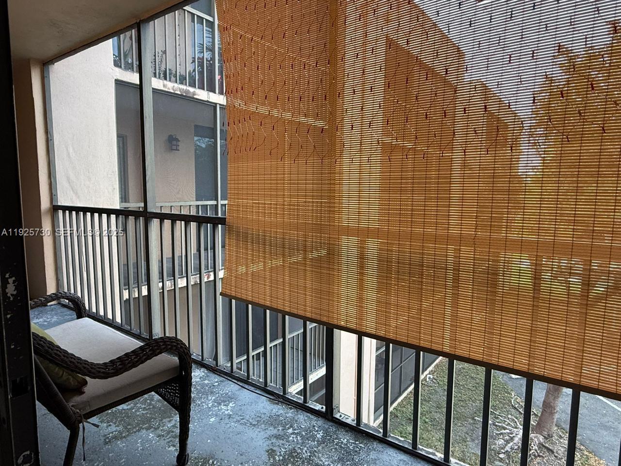 8600 Southwest 133rd Avenue Road, Unit 310 Miami, FL 33183 - Photo 6 of 22 a view of a balcony with a couple of chairs