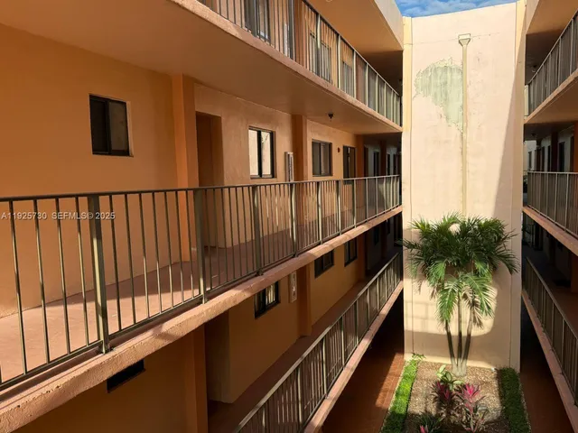 a view of balcony with furniture