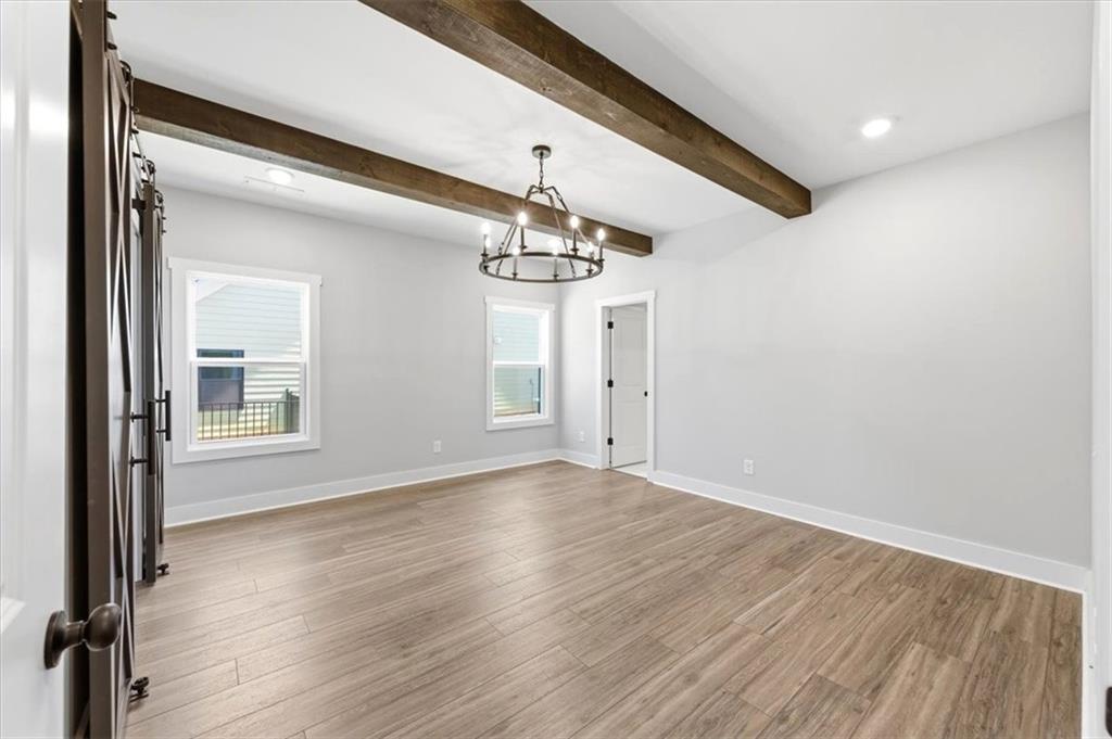 141 Old Alabama Road Southeast Emerson, GA 30137 - Photo 9 of 47 a view of a room with wooden floor chandelier and windows