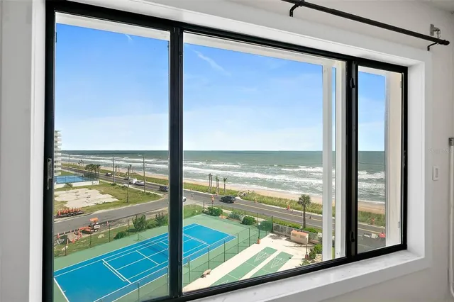 a view of a glass door and an outdoor view