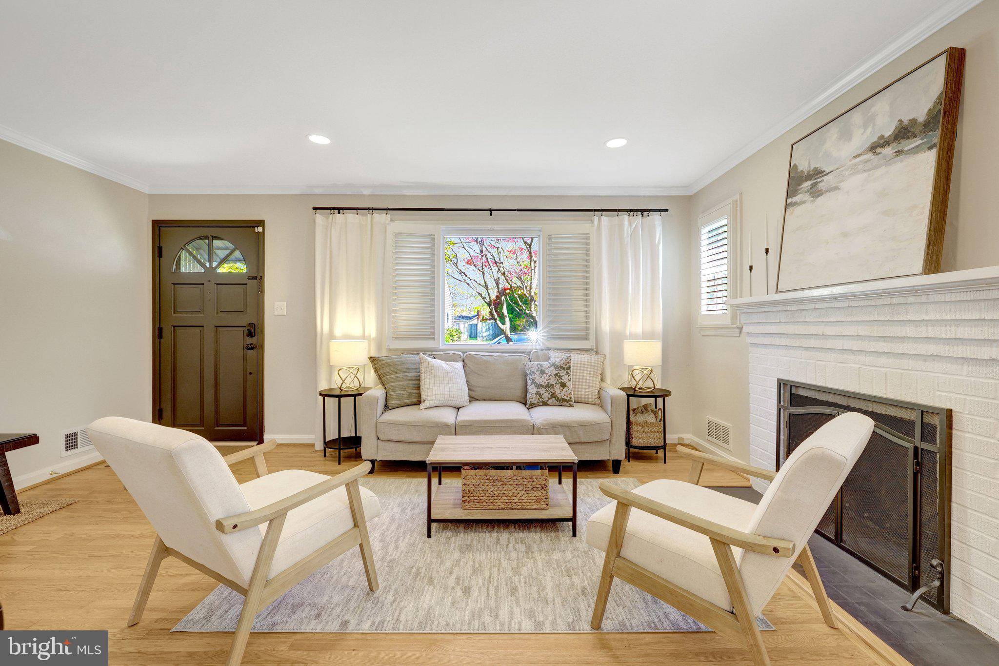 4132 Addison Road Fairfax, VA 22030 - Photo 11 of 58 a living room with furniture and a fireplace