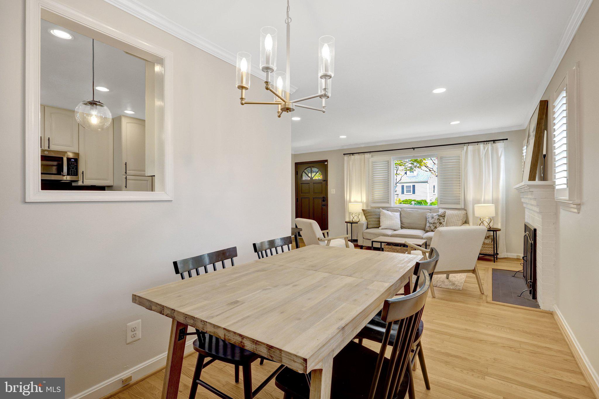 4132 Addison Road Fairfax, VA 22030 - Photo 15 of 58 a view of a a dining room with furniture window and wooden floor