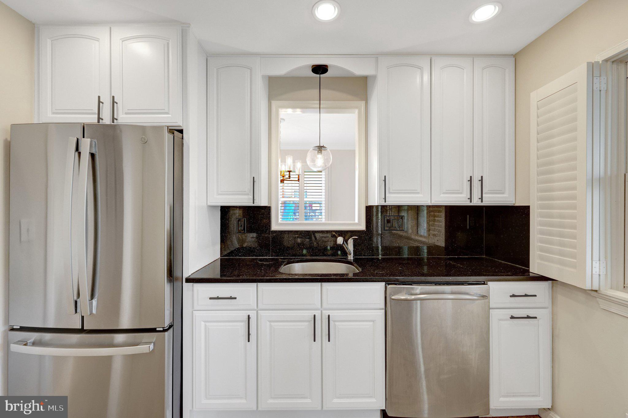 4132 Addison Road Fairfax, VA 22030 - Photo 18 of 58 a kitchen with stainless steel appliances granite countertop a refrigerator a stove and a sink