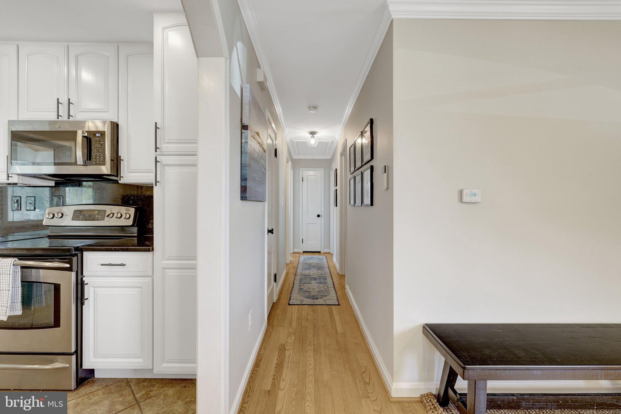 4132 Addison Road Fairfax, VA 22030 - Photo 22 of 58 a view of a kitchen from the hallway