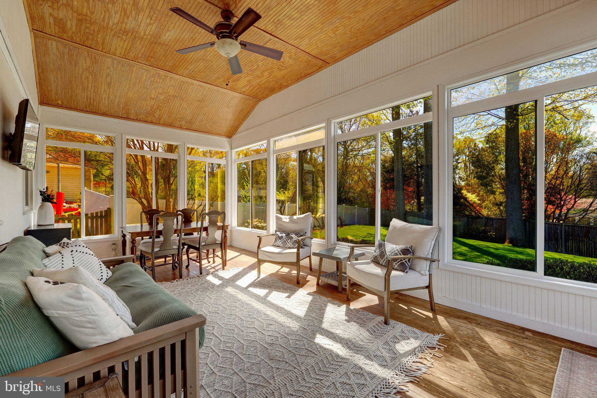 4132 Addison Road Fairfax, VA 22030 - Photo 23 of 58 a living room with furniture and floor to ceiling windows