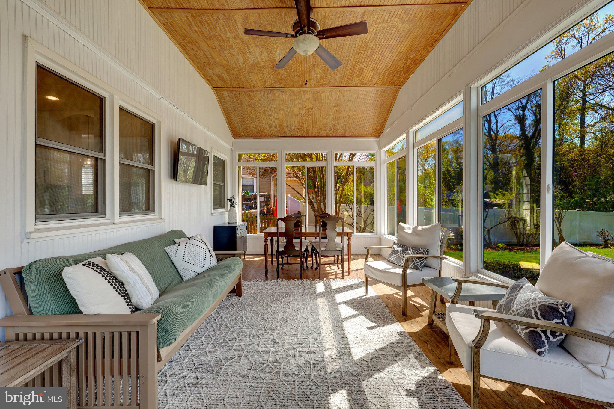 4132 Addison Road Fairfax, VA 22030 - Photo 25 of 58 a living room with furniture and floor to ceiling windows