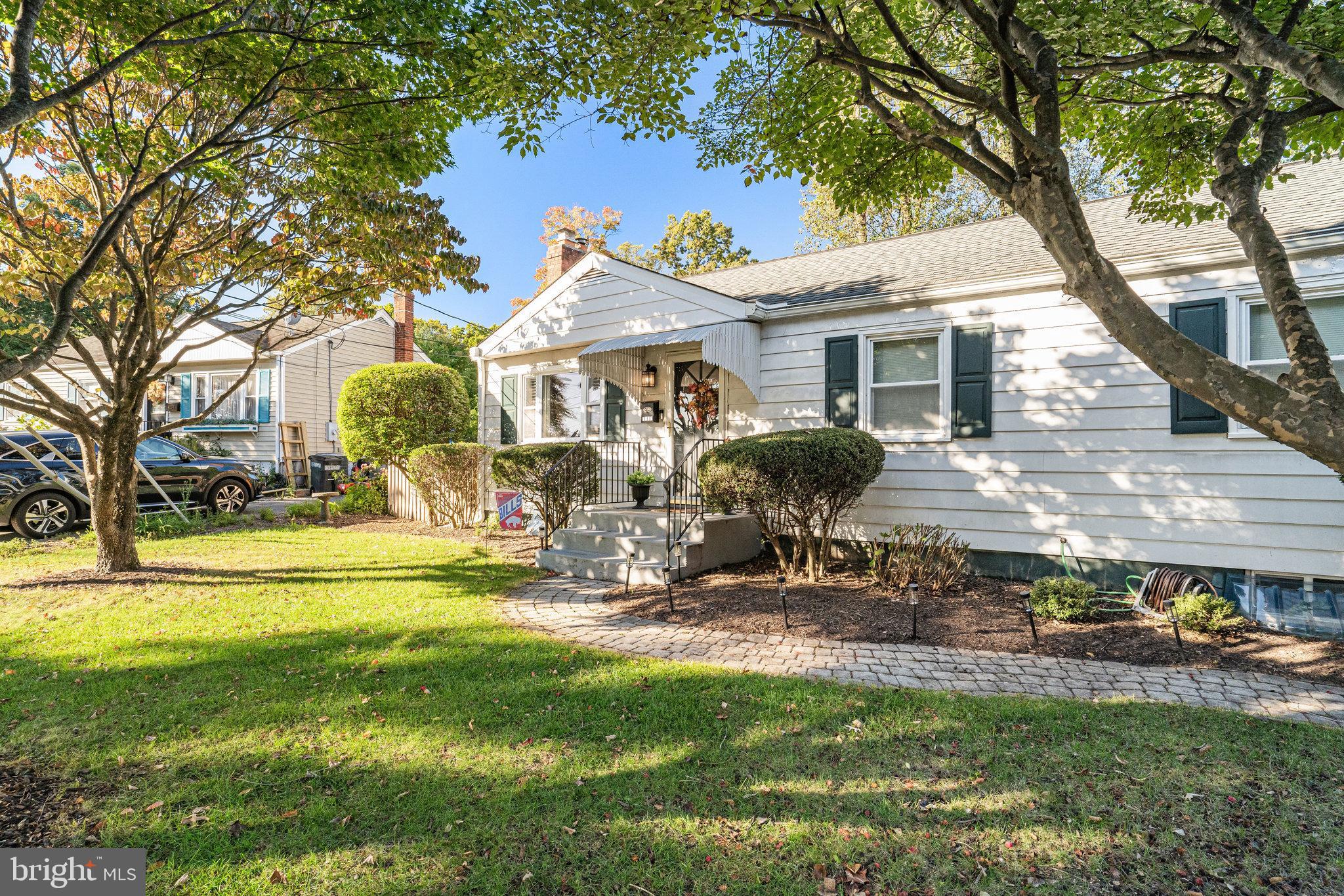 4132 Addison Road Fairfax, VA 22030 - Photo 3 of 58 a front view of a house with garden