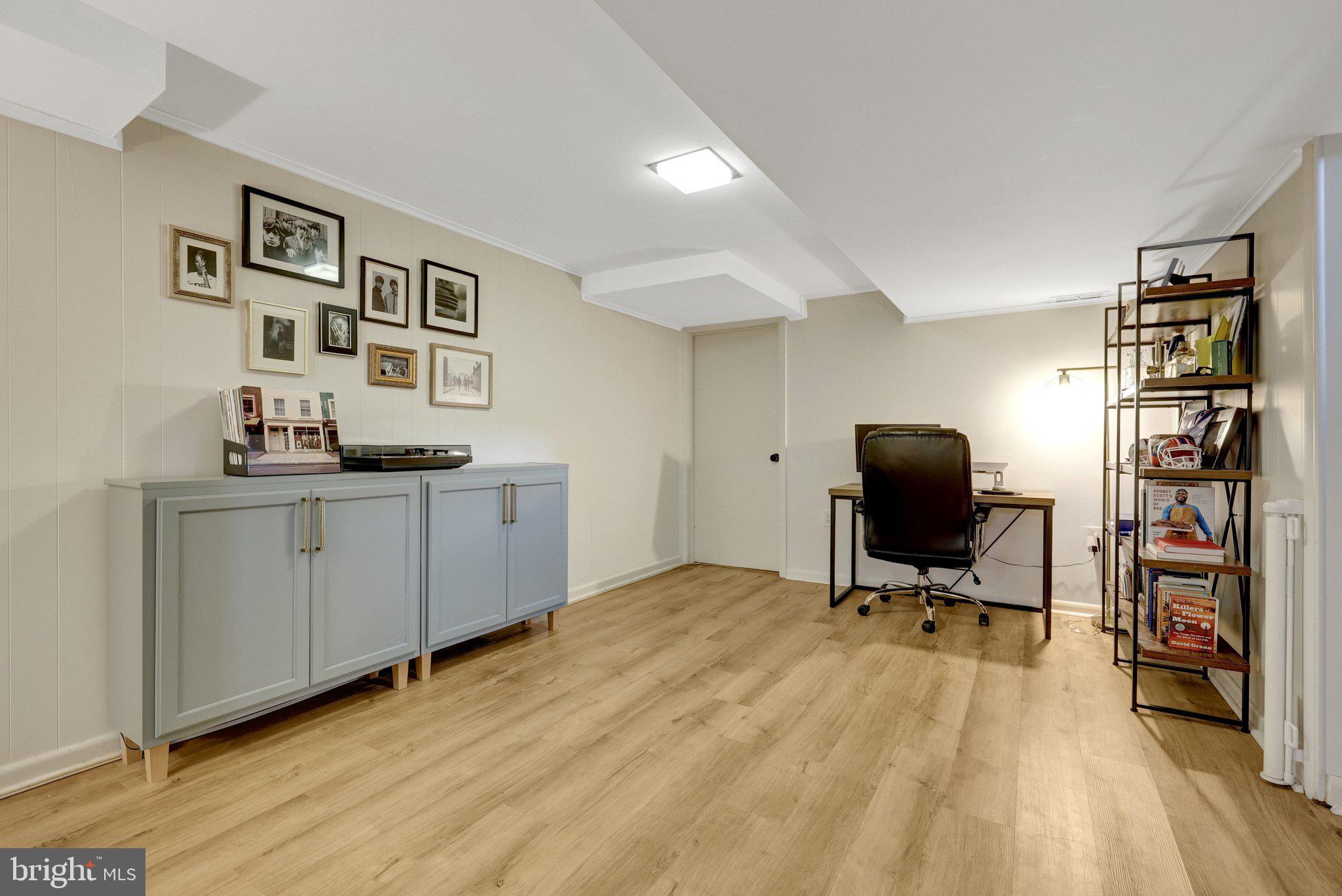 4132 Addison Road Fairfax, VA 22030 - Photo 35 of 58 a view of a workspace with furniture and wooden floor