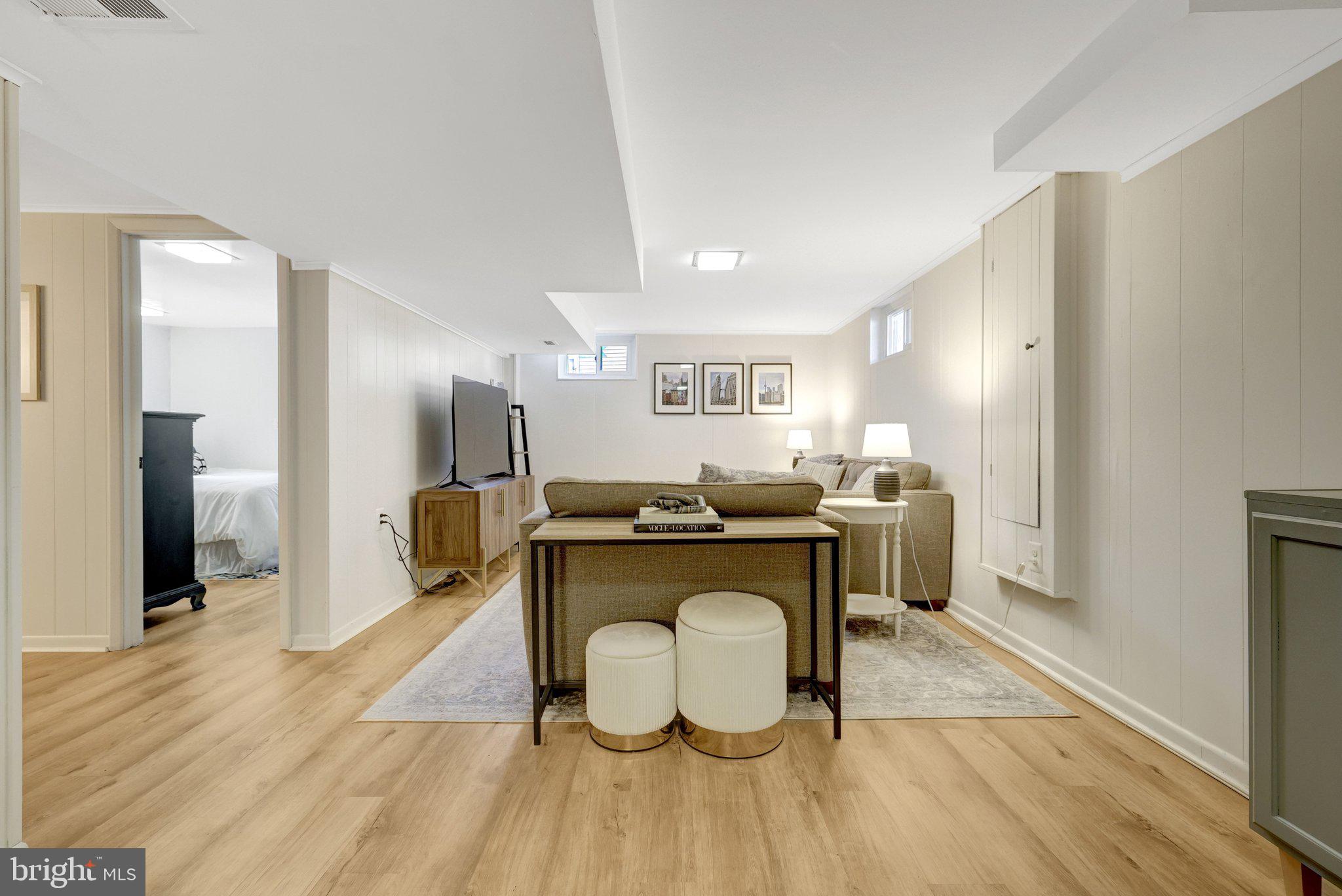 4132 Addison Road Fairfax, VA 22030 - Photo 36 of 58 a living room with a couch and a wooden floor