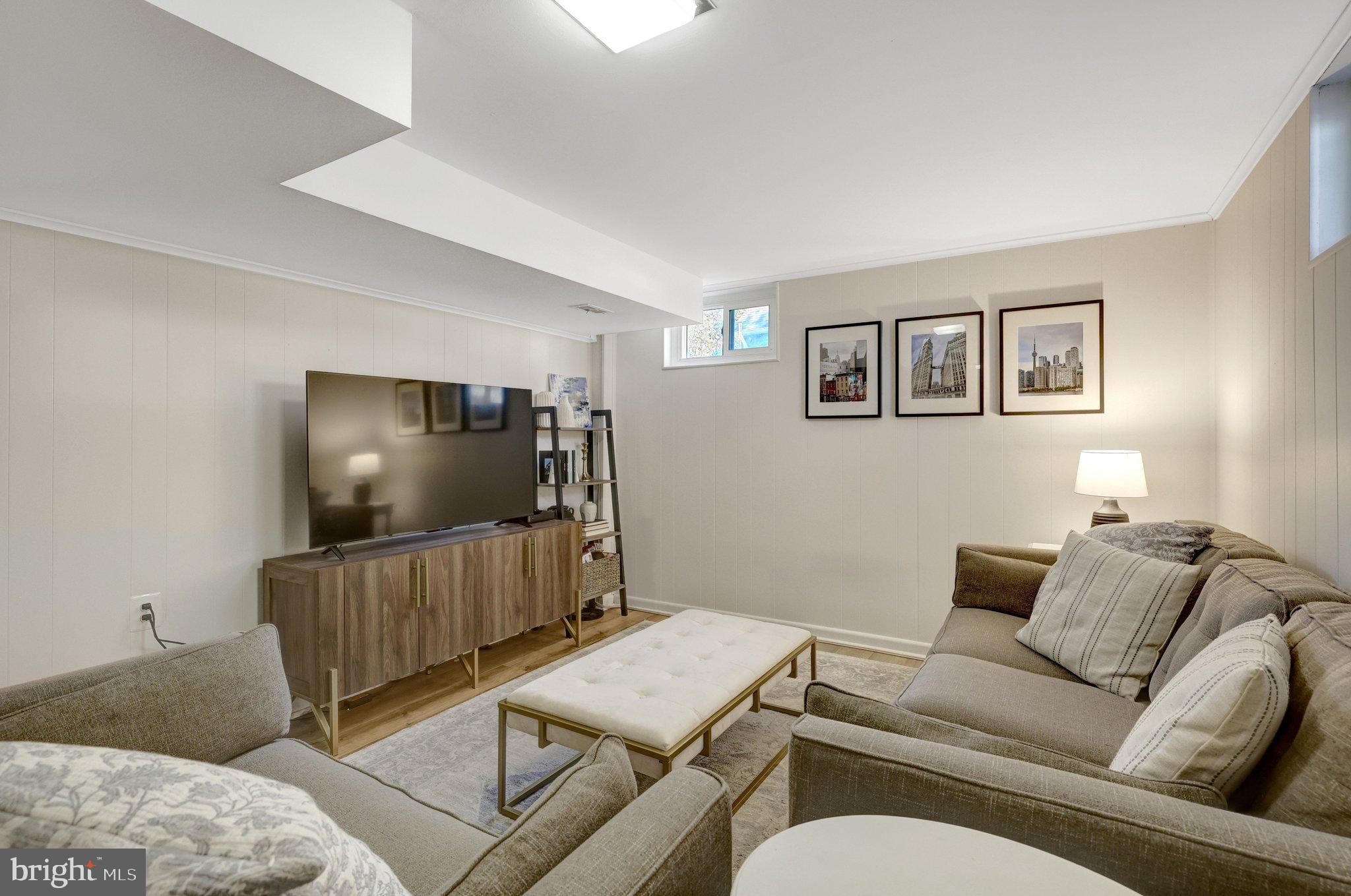 4132 Addison Road Fairfax, VA 22030 - Photo 37 of 58 a living room with furniture and a flat screen tv
