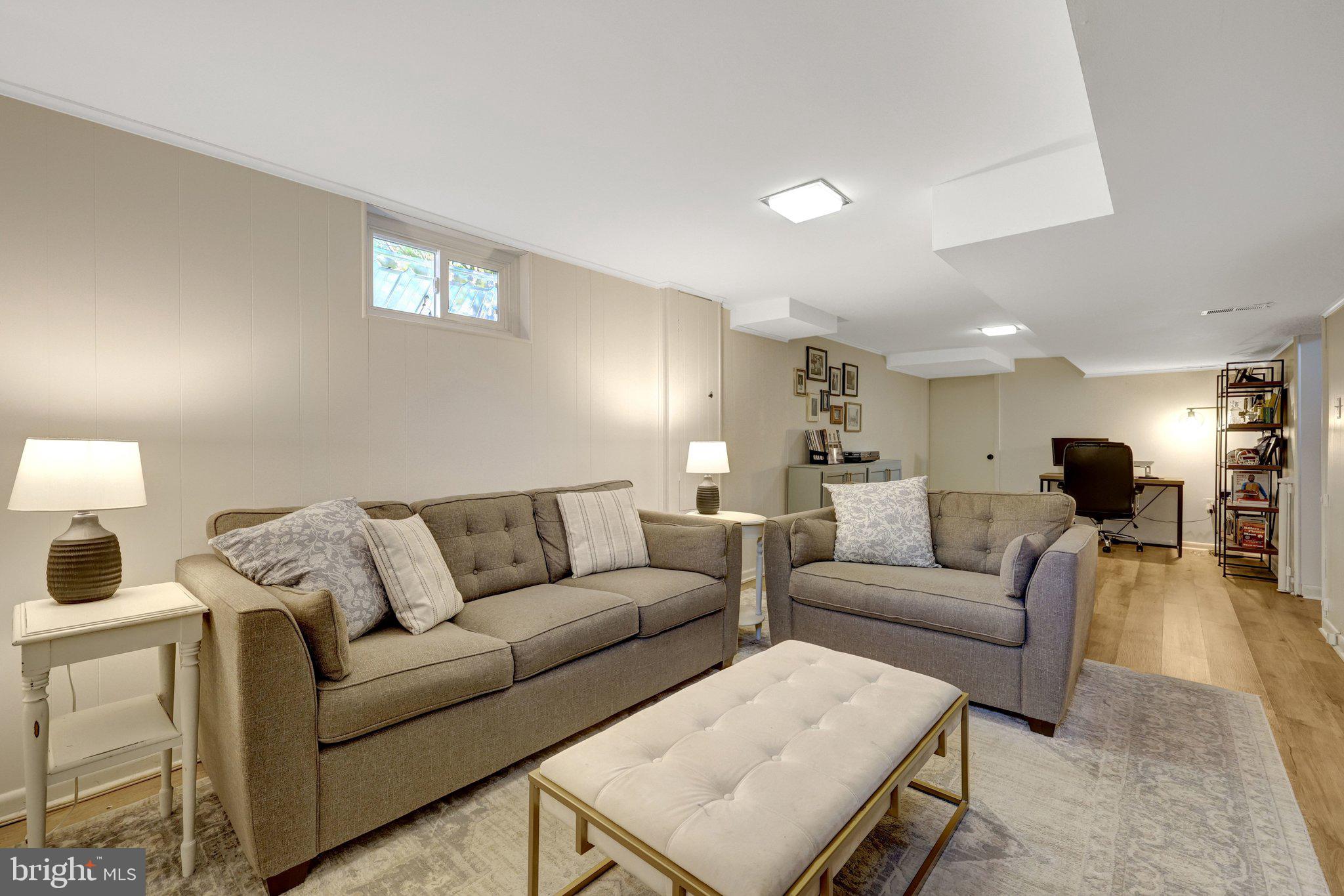 4132 Addison Road Fairfax, VA 22030 - Photo 38 of 58 a living room with furniture and a couch