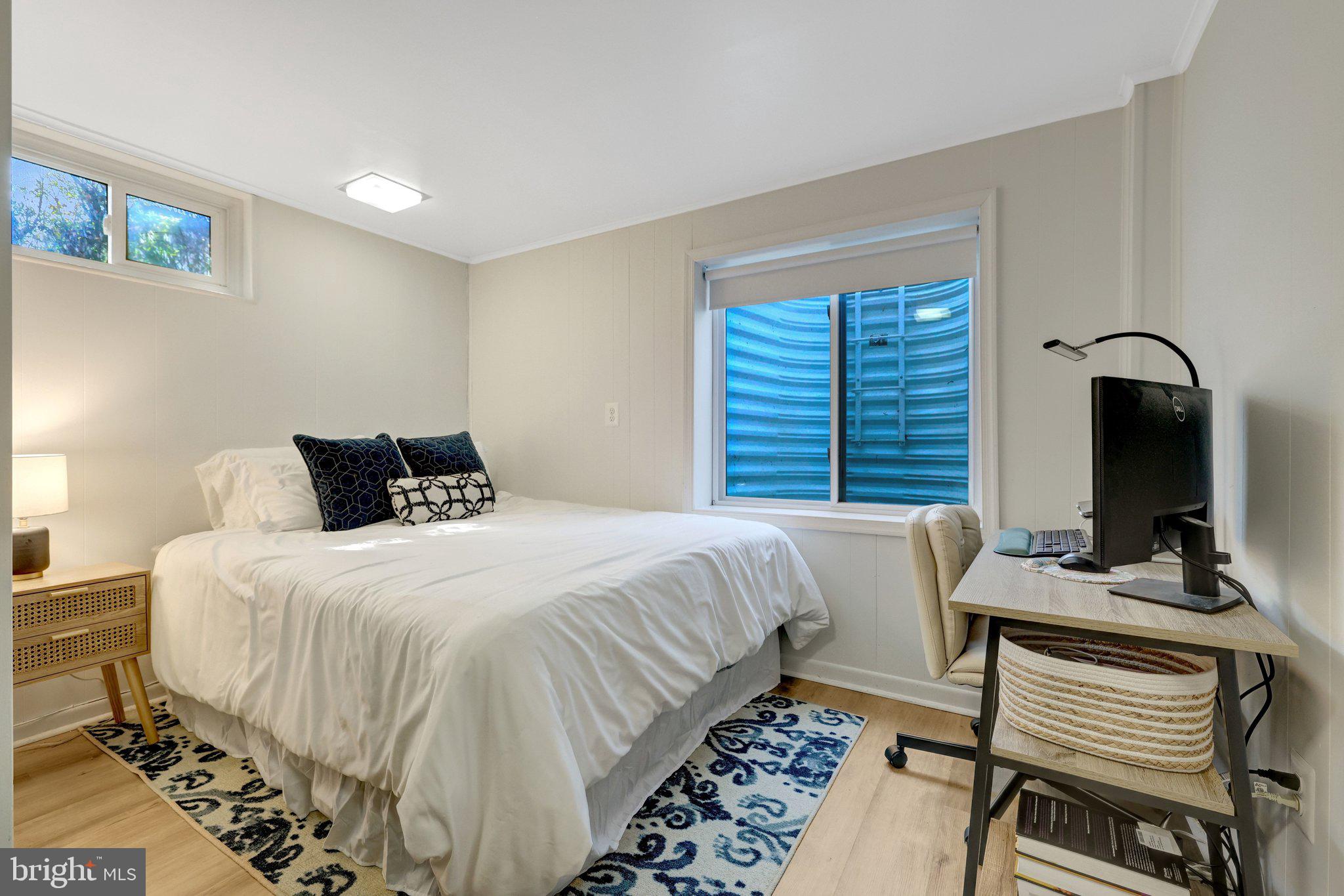 4132 Addison Road Fairfax, VA 22030 - Photo 41 of 58 a bedroom with a bed and a flat screen tv