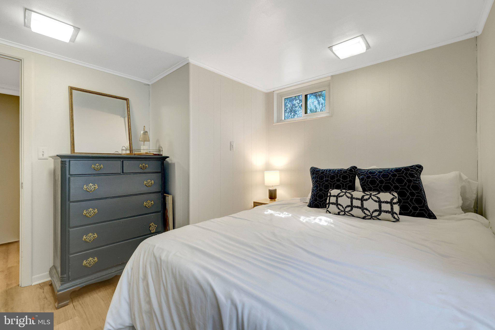 4132 Addison Road Fairfax, VA 22030 - Photo 42 of 58 a bedroom with a bed and a dresser