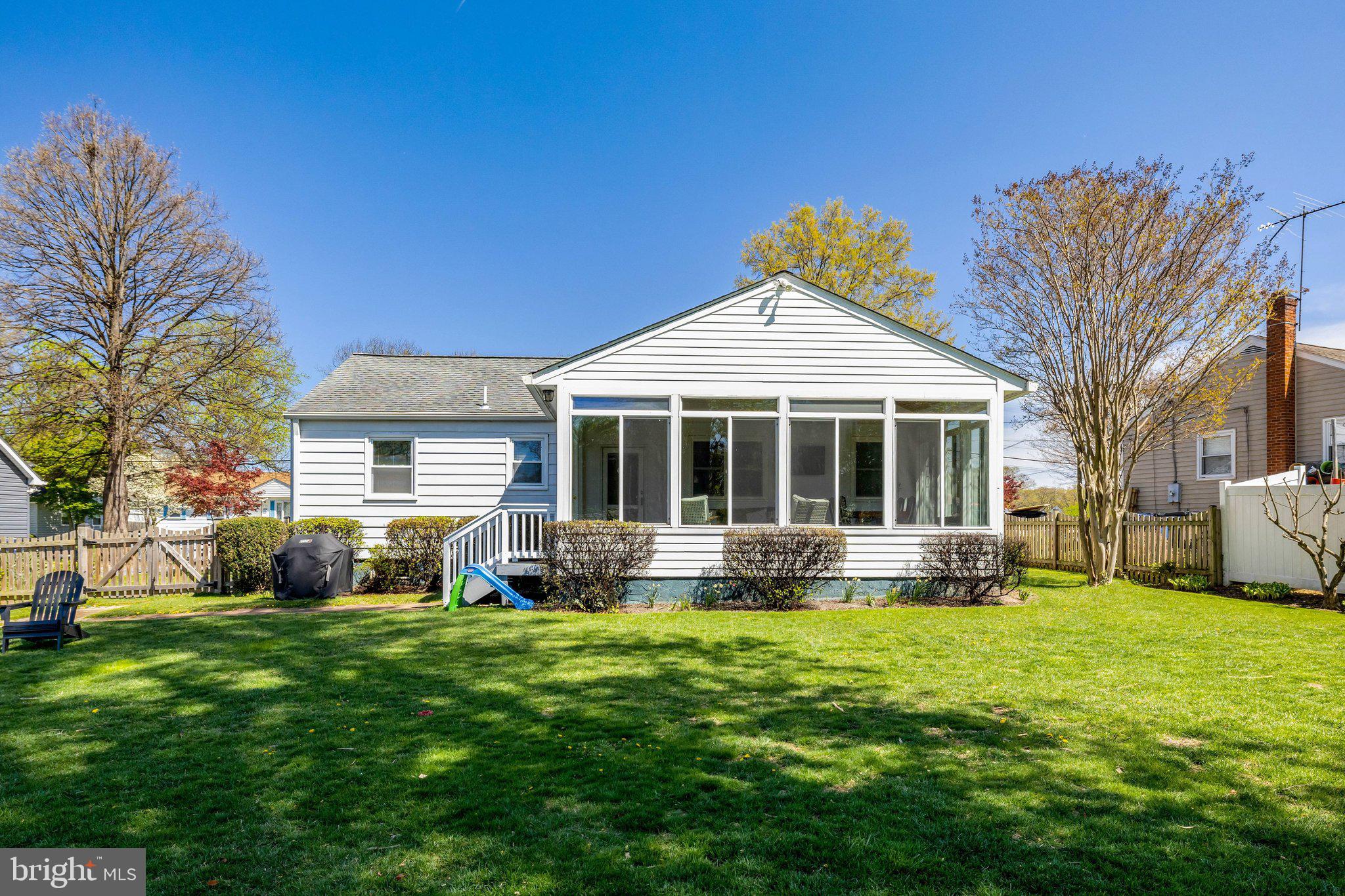 4132 Addison Road Fairfax, VA 22030 - Photo 49 of 58 a front view of a house with a yard and porch