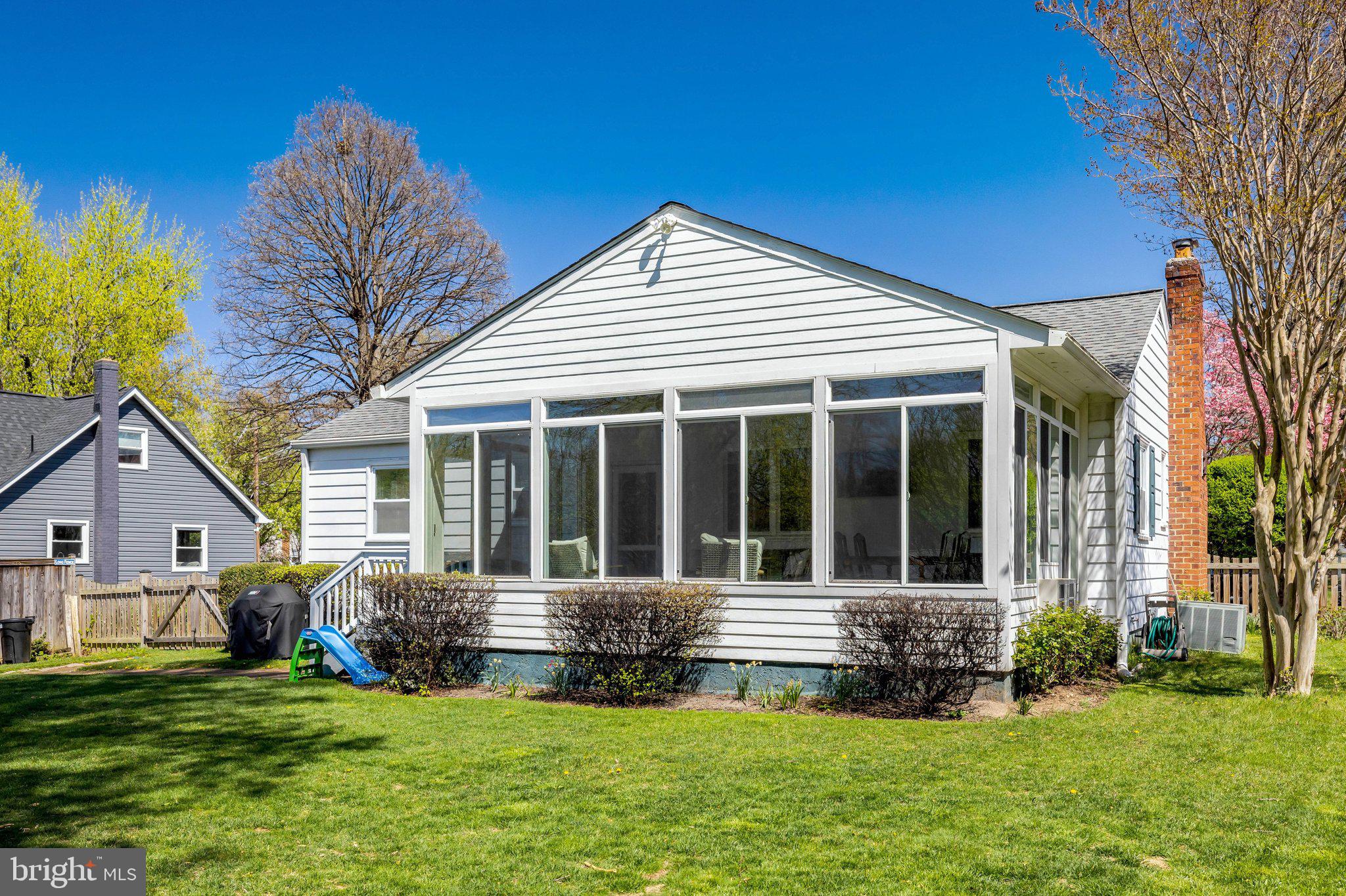 4132 Addison Road Fairfax, VA 22030 - Photo 50 of 58 a view of a house with a yard