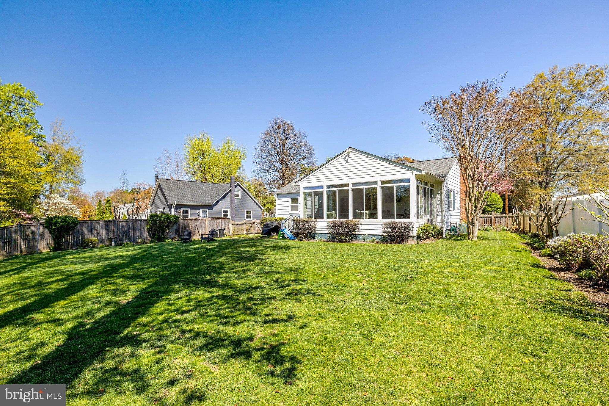 4132 Addison Road Fairfax, VA 22030 - Photo 51 of 58 a front view of a house with a garden