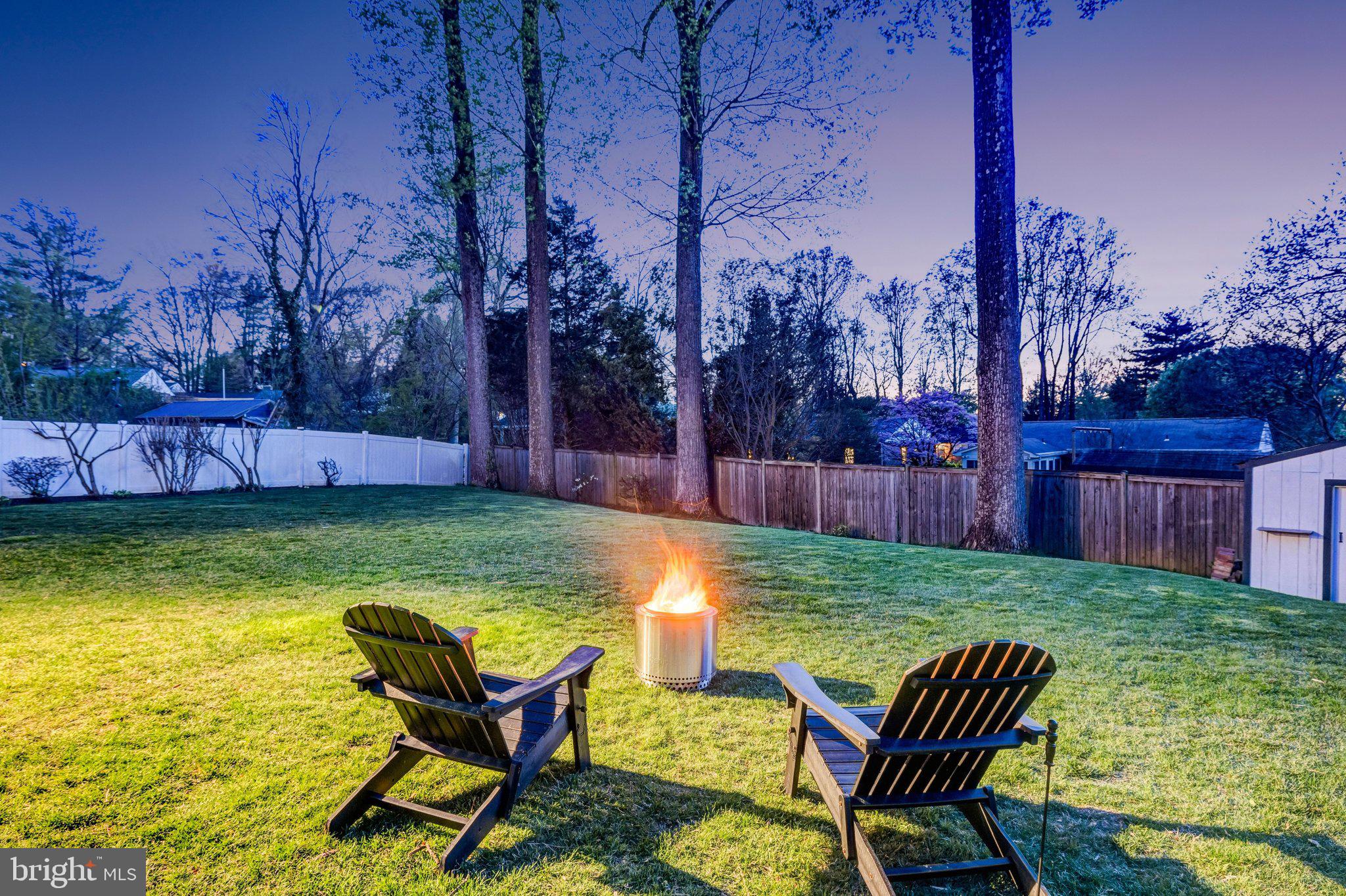 4132 Addison Road Fairfax, VA 22030 - Photo 55 of 58 a view of swimming pool with lawn chairs and wooden fence